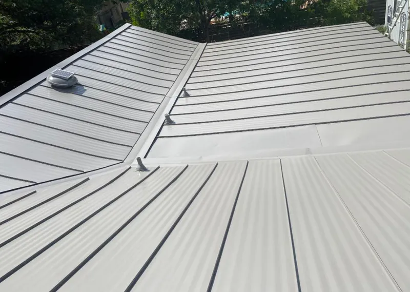 Solar attic fan installed on a metal roof for Roof Ventilation in Poinciana